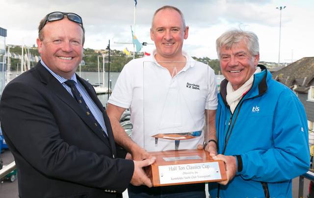Phil Plumtree, skipper of Swuzzlebubble (centre) receives the overall trophy from Thomas Roche, Commodore of Kinsale YC (left) and Philippe Pilate, President of the Half Ton Class at the prize-giving for the Euro Car Parks Half Ton Classics Cup 2017 at Kinsale Yacht Club, Ireland