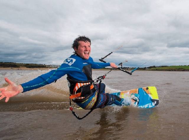 Niall Roche rips through the surf by kite