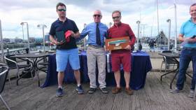 Ross Nolan (left) and Gordon Patterson (right) receive their Championship prize from Howth Yacht Club Commodore Ian Byrne