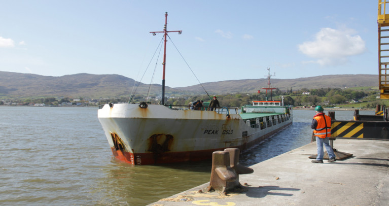 Carlingford Lough: Warrenpoint Port&#039;s AGM (Annual Report - 2019) was held virtually for the first time due to restrictions imposed by the impact of Covid-19. Above AFLOAT adds is the low-air draft general drycargo short-sea trader Peak Oslo (formerly Union Sun) on the Lough which derives its name from the Old Norse Kerlingfjǫrðr, meaning &#039;narrow sea-inlet of the hag&#039;. The ship in this foreshortened view is deceptive given its 87.66m length, a beam of 11.05m and a draft of 2.7m. The 1985 built / 1,543 grt ship is from the an original series built for Union Transport Group based in Kent, UK, that included Union Moon which along with a ferry collided into eachother in Belfast Lough as Afloat reported in 2012. Later that year the MAIB deemed both vessels at fault for the incident. 