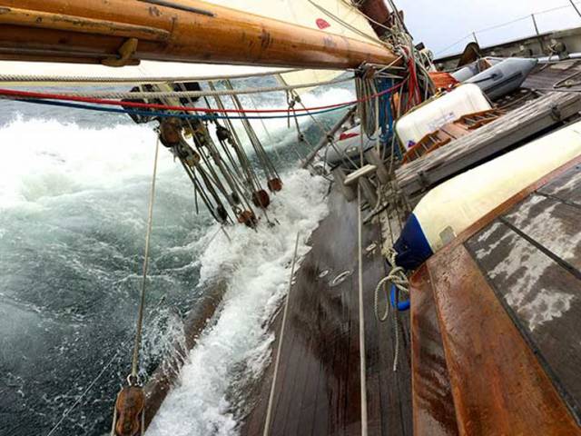 Editorial desk with a difference……..on board the 64ft gaff cutter Annabel-J, powering along off the West Coast of Ireland. Annabel-J is owned by long distance voyager Andrew Wilkes and his wife Maire Breathnach of Dungarvan, who is currently Honorary Editor of the Irish Cruising Club Annual