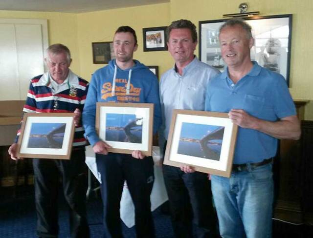 Derek Joyce (right) of 187 Zuleika, claiming his Leinster title pictured with his crew James Sinnott and Cillian Joyce and Michael Conway of Wexford Harbour Boat and Tennis Club