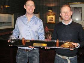 Ronan Kenneally (left) is presented with &#039;The Yard-of-Ale&#039; Trophy by Charles Dwyer on Winning the Monkstown Bay Sailing Club&#039;s Laser Winter League for the second-year in succession