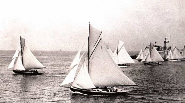 There are two diametrically opposed ways of looking at this photo of the Dublin Bay 25s starting a race a very long time ago through the entrance of Dun Laoghaire Harbour. You either loathe it as being a way of beginning a race which puts too much emphasis on luck. Or you can love it as being a celebration of wayward sailing skills which rely on local knowledge and sheer cunning.