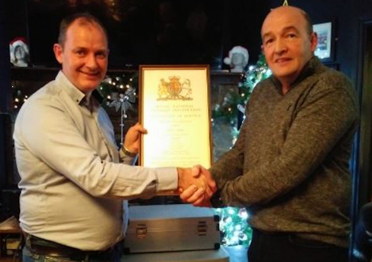 Deputy launching authority Brendan O’Driscoll (left) presents John Innes with a certificate of service