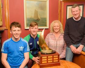 The Durcan family: twins Harry and Johnny, with mother Yvonne and father Tom andThe Pyewacket Trophy at RCYC on Friday night