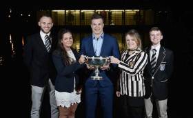 Max Murphy, UCD, Ruth Gilligan, UCD, International rugby player Josh Van Der Flier with the Gannon Cup, Megan Jungmann, TCD and Cian Flynn, TCD. 