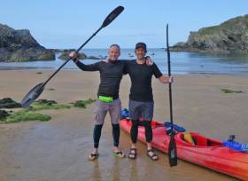 Mike Alexander with kayaking novice Alan Creedon after reaching Dun Laoghaire from Holyhead in a gruelling 22-hour paddle across the Irish Sea
