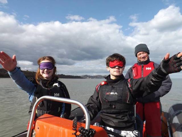 Instructors in powerboats while blindfolded during a Bray Sailing Club training session