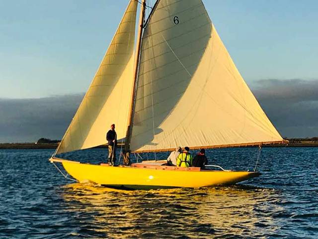 “The light of other days…..” The Dublin Bay 21 Naneen sails for the first time in 33 years in the otherworldly illumination of December sunshine on the Shannon Estuary. Photo: Kate Griffiths