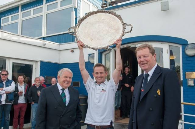 Supreme champion. 2016 winner Alex Barry holds aloft the historic silver salver with ISA President David Lovegrove (left) and RCYC Admiral John Roche. 