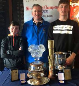 Cathal and Aidan Cronin, Commodore of CYBC and Eoghan at the prizegiving