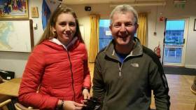 Laser Frostbite race winner, Radial sailor Claire Gorman from the National Yacht club collects her prize from DMYC&#039;s Neil Colin