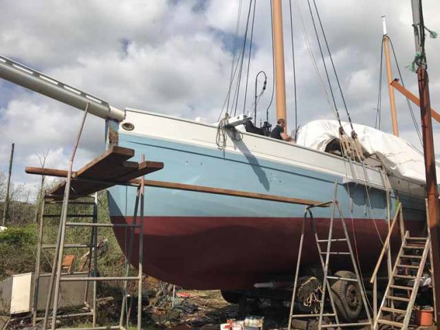 Removing the tarpaulin from Ilen as work continues on the historic vessel