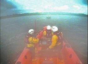 The lifeboat crew set up an astern tow and took the boat from the rocks and into safe waters