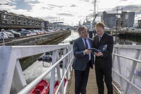 Minister for Marine Micheal Creed and Dr Stephen Hynes co-author of the report and Director of SEMRU (NUIG) discussing the latest figures from the 2019 Ireland&#039;s Ocean Economy Report which was launched yesterday above at Cork City Marina.
