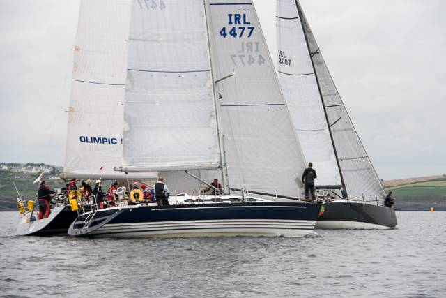 Jump Juice with Prof O’Connell on helm (and David Harte calling tactics) gets ahead of KYC Commodore Tom Roche sailing Meridian with Conor Doyle to weather in Freya. Scroll down for photo gallery