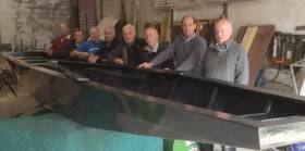 Some of the boat building team with a Lough Erne Cot produced in a joint effort between Cavan Town Men’s Shed and Lough Erne Heritage in 2016