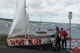 Is this GP14 crew commenting on the decision to launch in the big winds last Saturday? In fact, the &#039;graffiti&#039; on Des McMahon&#039;s hull is the first few lines from a song by Irish rappers,Versatile
