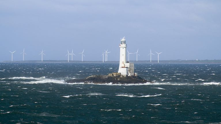 Mark of the course – the Tuskar Rock with turbine-cluttered Carnsore Point beyond. Magenta Project has got there from Dublin Bay in just a morning's sail
