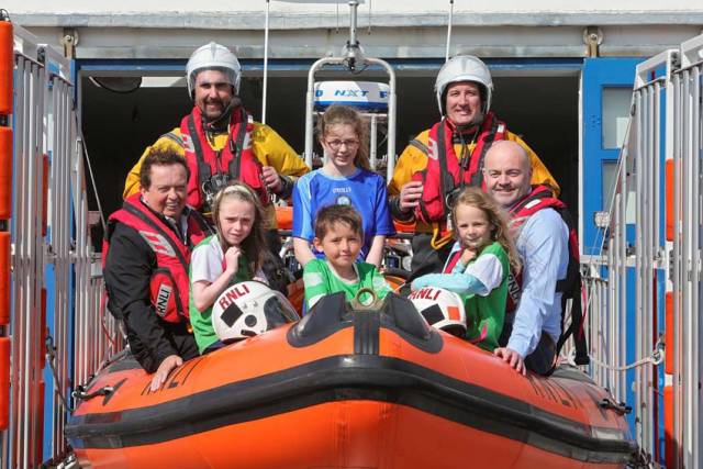 GAA personalities Marty Morrissey and Anthony Daly with local GAA players at Kilrush RNLI