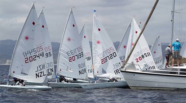Ireland's Annalise Murphy is among other competitors trying to squeeze past the Committee Boat vessel at the start of a qualifying race at the Women's Laser Radial World Championship in Mexico