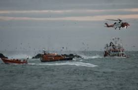 Portaferry and Newcastle RNLI working with Rescue 116 to rescue the crew of the grounded fishing boat