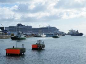 The massive cruiseship MSC Splendida compared to a P&amp;O Ferries vessel preparing to berth in Dublin Port