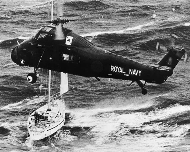 Fastnet '79 Yacht Race Disaster: A Royal Navy helicopter rescues the crew of the yacht “Camargue” during the Atlantic storm in August 1979