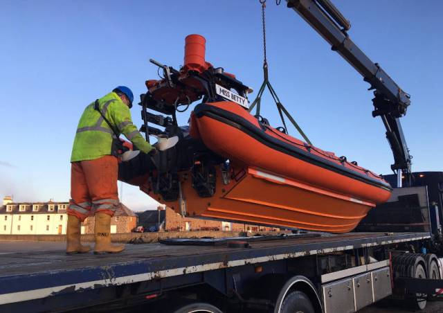Stonehaven RNLI’s Atlantic 75 Miss Betty is lowered onto a trailer for transport to RNLI HQ in Poole