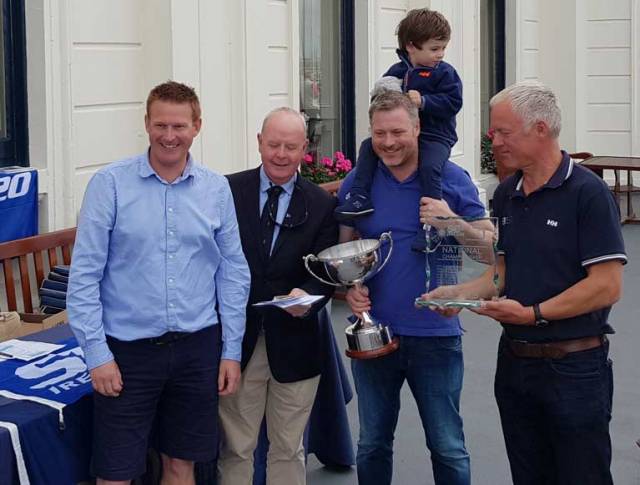 Royal Irish Yacht Club Vice Commodore Pat Shannon (second from left) presents the overall trophy to the winning Bád Kilcullen crew Kieran Dorgan (left) Stefan Hyde and son and Jimmy Dowling