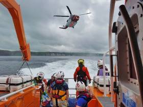 Portrush RNLI assist with the rescue of a man who fell on rocks near Dunluce Castle