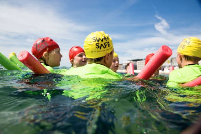 Children take part in a Swim Safe session in Poole, Dorset