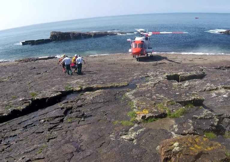 The female casualty is transported to Rescue 118 following a fall at Mullaghmore Head