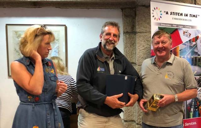 Dragon Slayers – Wife of Class captain David Williams, Hilary, presents the prizes to winners John Simms (centre) and Martin Byrne. Not pictured is third crew man Adam Winkelmann 