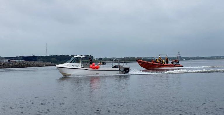 Fishermen Patrick and Morgan Oliver who located the missing paddleboarders being accompanied by Galway RNLI Crew into Galway Harbour