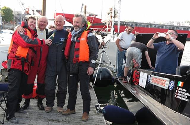 Round Ireland record holder Sean McNamara, Denis Dillon, Philip Fitzgibbon and John Ryan celebrate in Kinsale having set a new record time of 12 hours 54 minutes and 24 seconds