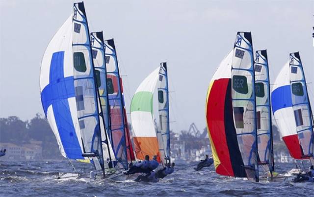 The tricolour spinnaker of Ryan Seaton and Matt McGovern is clearly visible at the front of Rio's 49er fleet. The Northern Ireland pair won race four today to lie second overall after four races sailed