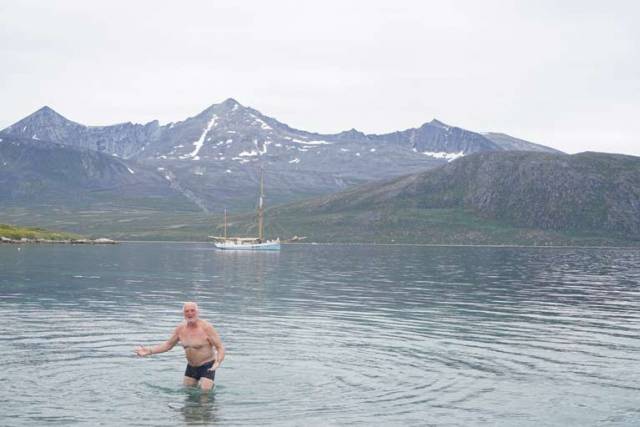 Breanndán Ó Beaglaoich goes swimming in Greenland with Ilen anchored in the Bay at Cape Farewell