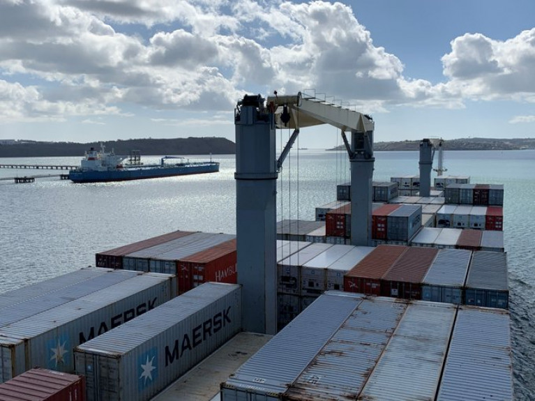 The CSO has released new figures on the performance of six of the main Irish Ports. Above: a containership departing in lower Cork Harbour and where a tanker is berthed at the Whitegate Oil Refinery. 