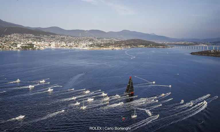 Comanche made the final dash to the Rolex Sydney Hobart finish line contending with fickle breeze ahead of the other four super maxis