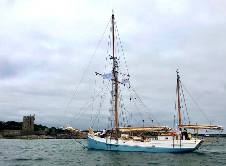 The restored 1926 ketch Ilen takes her departure for Greenland from the MacMahon stronghold of Carrigaholt Castle on the Shannon Estuary