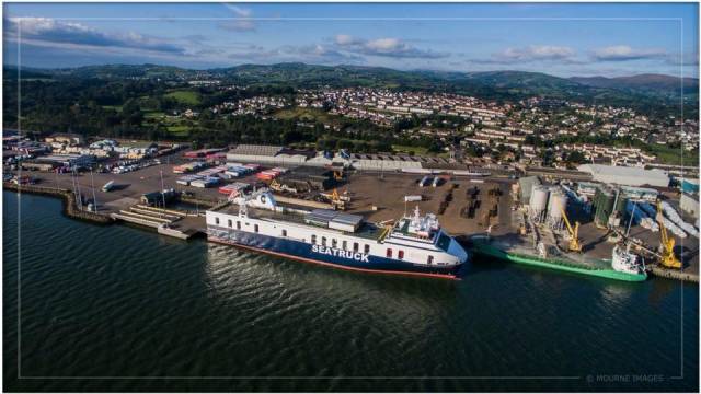 Warrenpoint Port, Co. Down is inviting members of the public and stakeholders to make comments and views on a dredging proposal. Above Afloat adds is Seatruck's newly introduced Seatruck Performance a FSG / 'Heysham-max' class ro-ro freightferry which operates to the Lancashire port. Ahead of the ro-ro ferry is an Arklow Shipping R class short-sea trader. 