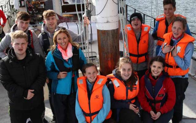 BBC 1 Songs of Praise Presenter Claire McCollum with the young cross border crew on the Brian Boru in Carlingford Lough.