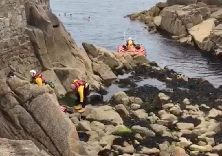 Coastguard and lifeboat crews attending the scene at the Forty Foot yesterday