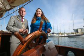 Belfast Lord Mayor Councillor Arder Carson with one of the tallship volunteers, Niamh Macklin from Bryson Future Skills on board the Maybe