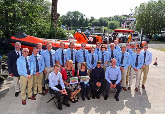 The new inshore lifeboat pictured with hew crew which is now located at Carrybridge and which has launched 13 times since going on service, was officially named Douglas, Euan & Kay Richards