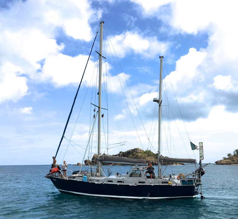 The ketch Danu leaving harbour in Antigua, homeward bound for Galway Bay with 12-year-old Lillian serenading from the foredeck