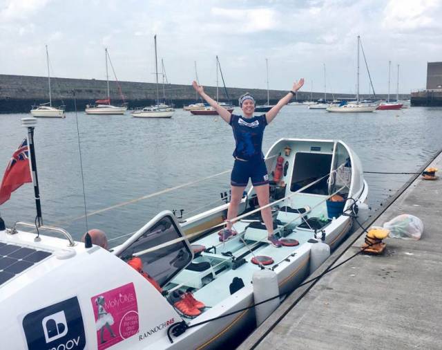 Laura Try and her custom ocean rowing boat docked in Dun Laoghaire