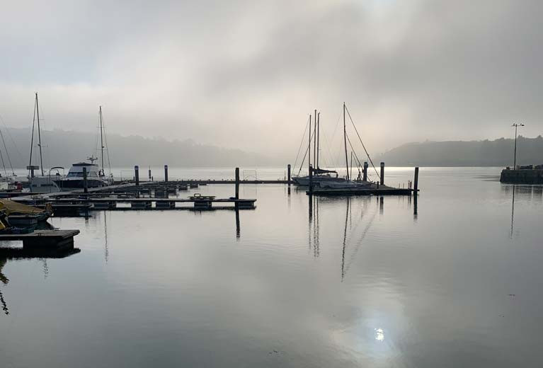 Foggy morning in Kinsale with empty berths highlighting the new marina sections